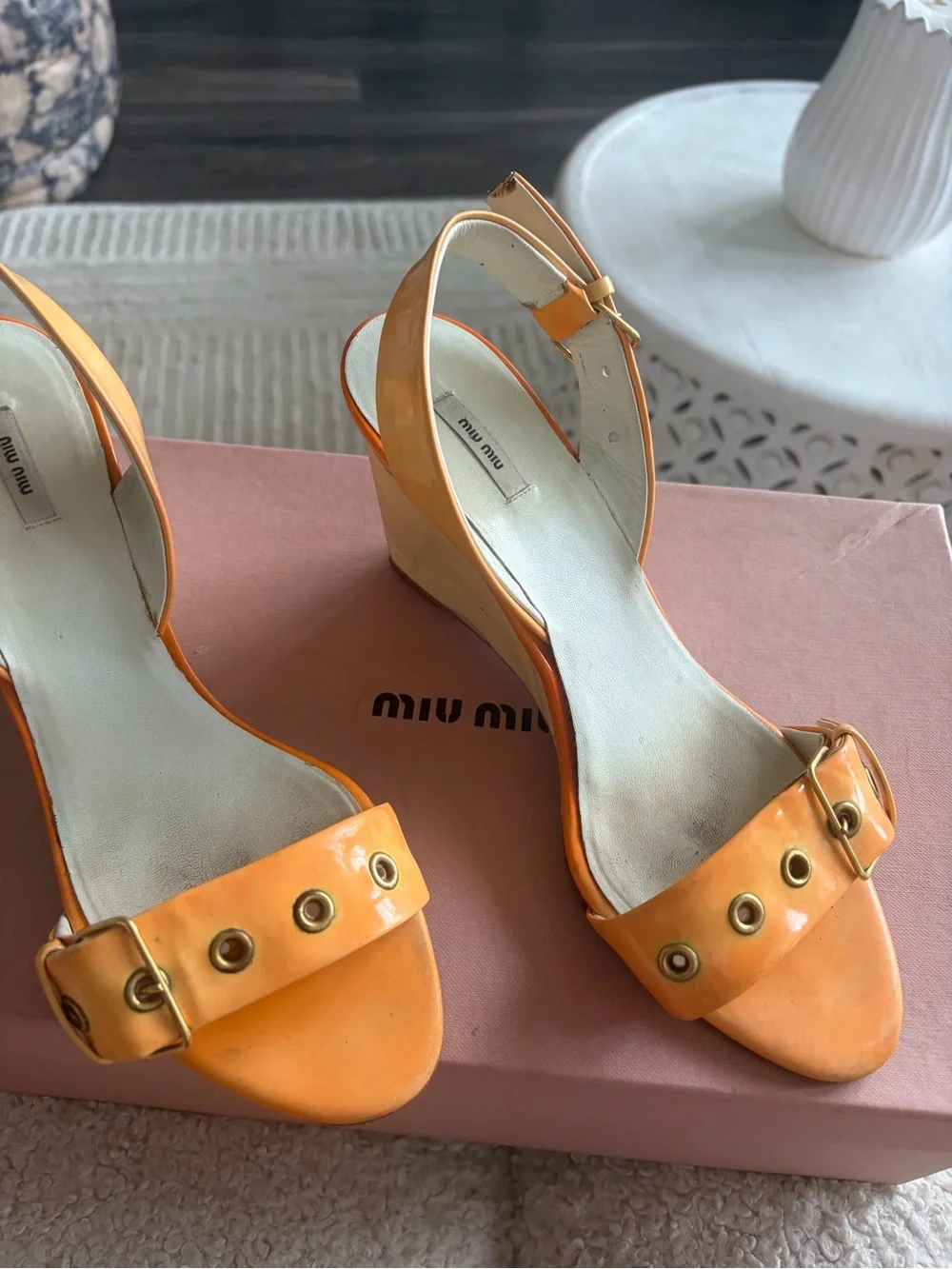 Miu Miu Orange Patent Leather Wedge Sandals with Gold Grommets